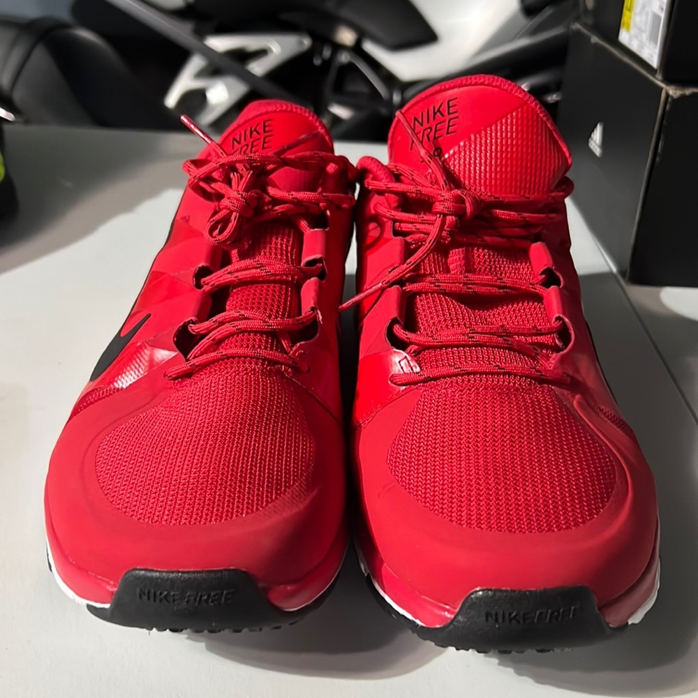 Nike free 5.0size 13 red color with white bottom.